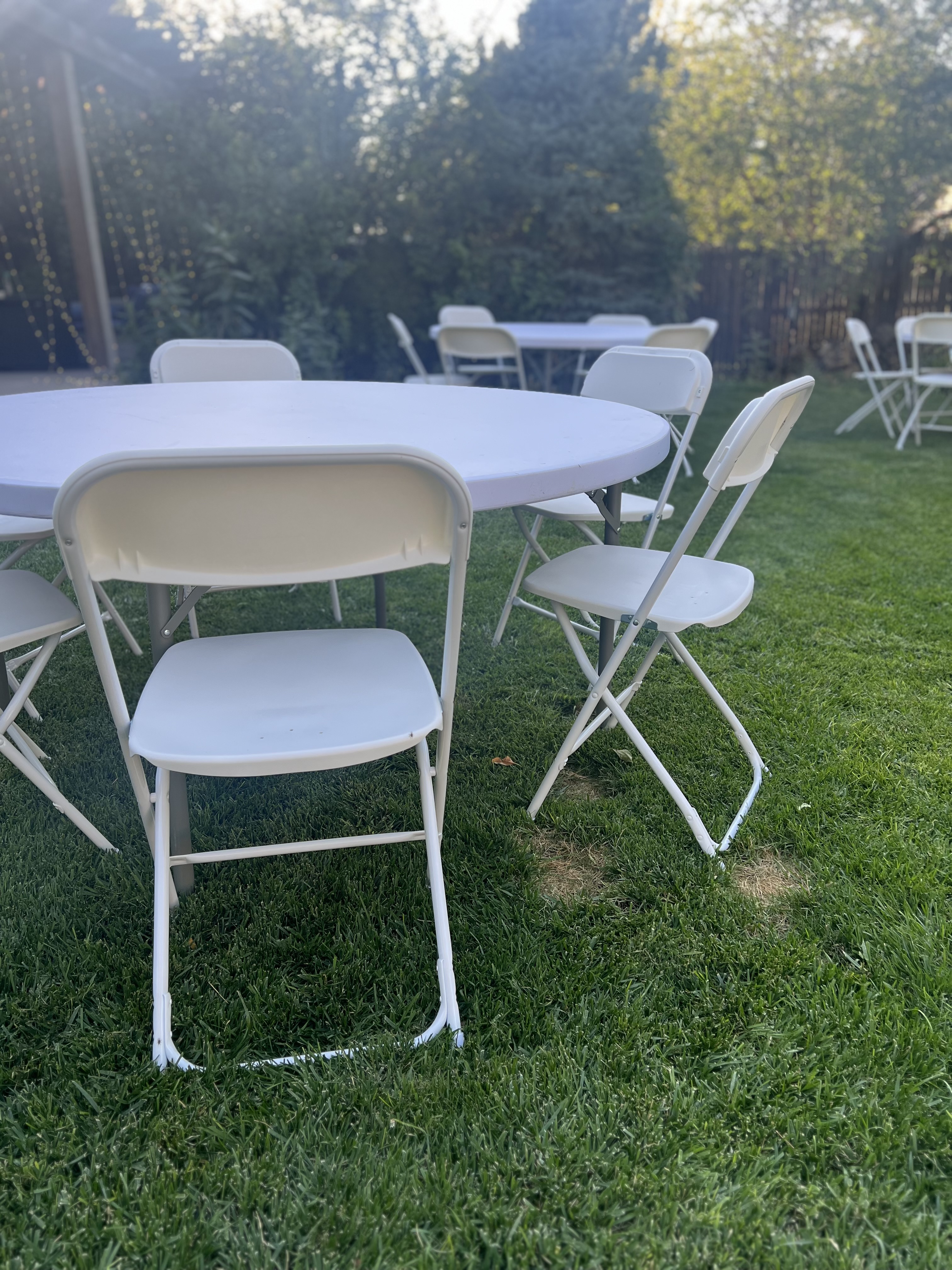 White folding chairs arranged for an event